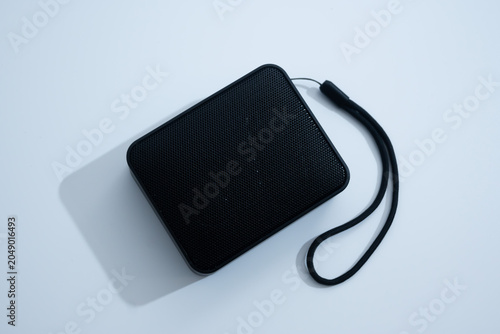 Bild auf Leinwand Compact Black Bluetooth Speaker with Strap