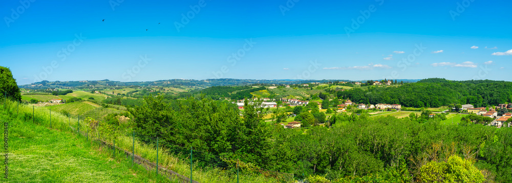 Naklejka premium Early summer panorama of the Orcia Valley. It's a countryside area in Tuscany (Italy), between Siena and Grosseto Provinces, world famous for its iconic landscapes, frequently used as movie locations.