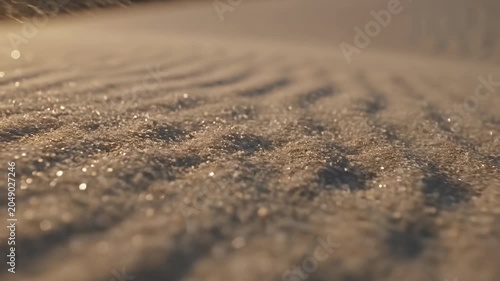 Macro shot of sand ripples in golden sunset light