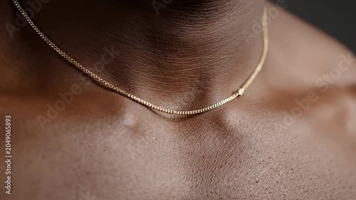 Man Wearing Gold Chain Necklace Showing Detail and Movement
