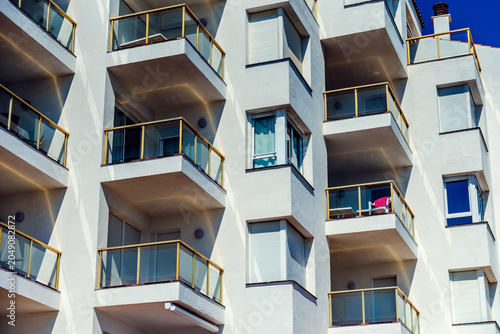 Typical holiday resort apartments and hotel facade in Spain during summer