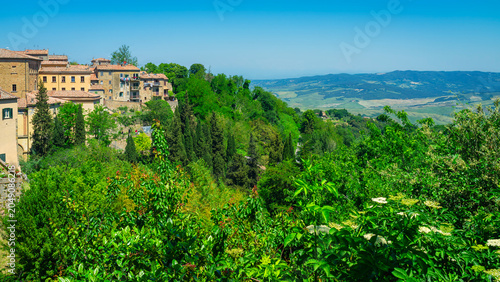 Bild auf Leinwand Panoramic view of Volterra (Tuscany village, Italy) during early summertime, with its surrounding hills and countryside