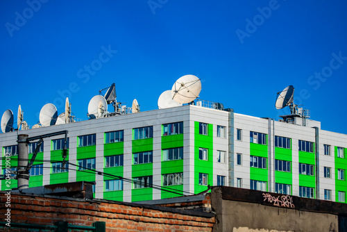 Photography A row of satellite dishes on the roof of the RT TV channel's office