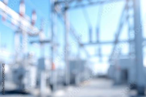 Abstract blurred background of an electrical power substation. High voltage grid and industrial energy infrastructure. Technology and power generation concept