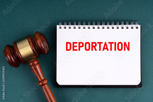 Gavel and notepad with text Deportation