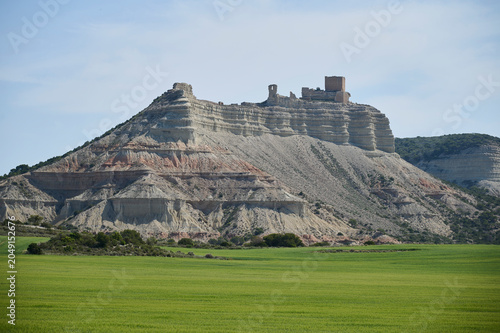 Ancient Castle ruins atop mesa near Sora under blue sky