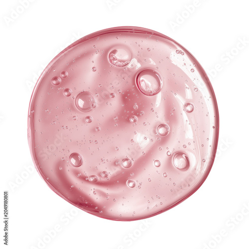 Close-up of a translucent pink gel droplet with air bubbles suspended inside, displayed on a white background.