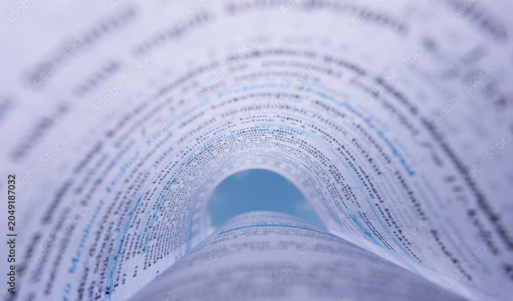 Fototapeta premium Open Book Pages Curved into Abstract Tunnel Shape