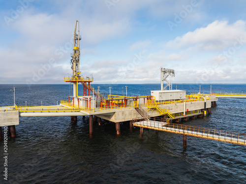 Quadro su tela Aerial side view of LNG gas terminal platform with pipeline infrastructure in Paldiski, Estonia, industrial offshore marine station