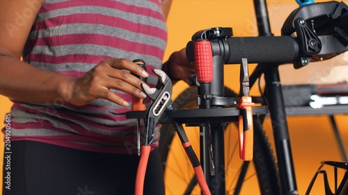 Slika na platnu Close up of specialist preparing work tools before starting patching up faulty bicycle parts