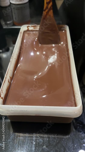 chocolate cake batter is poured into the cake pan
