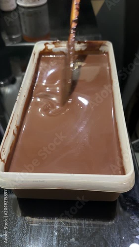 chocolate cake batter is poured into the cake pan