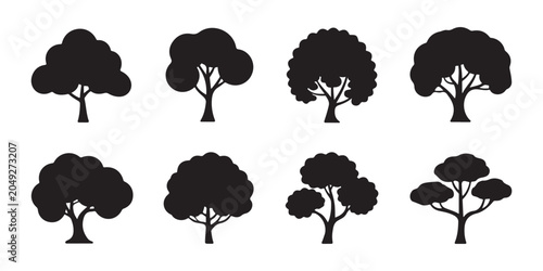 Collection of eight tree silhouettes, vector illustrations on transparent background, simple designs.