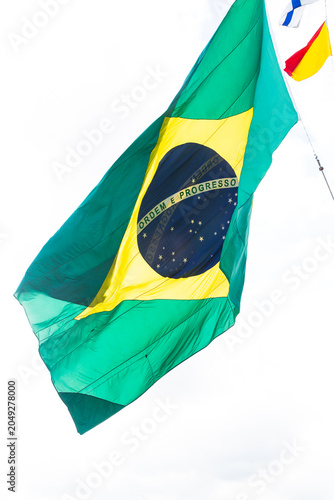 Brazilian Flag Waving Against Bright Sky
