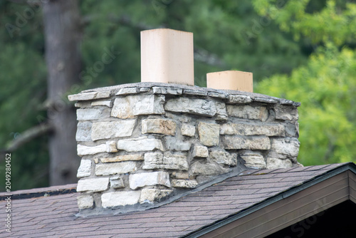 A stone chimney on a house