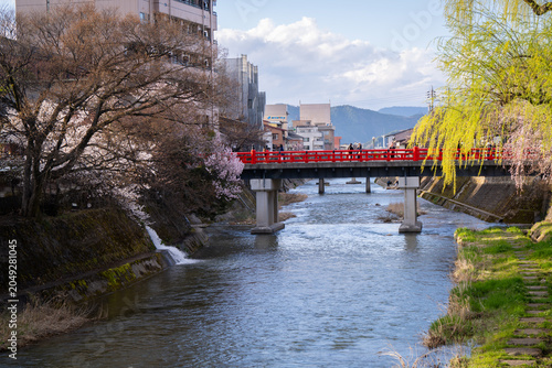 Bild auf Leinwand popular red bridge Nakabashi where people come to see and take photo with river