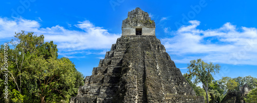 Photography A panoramic wide angle view of the historic stone stepped pyramid known as Templ