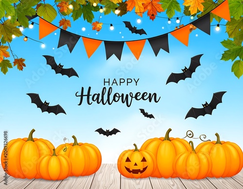 A Halloween scene with pumpkins and decorations on a wooden surface