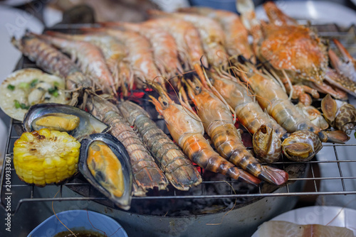 Schilderij op canvas Grilled food, or Thai-style barbecue like Moo Kratha (Thai-style grilled pork), in buffet style is becoming very popular in Thailand