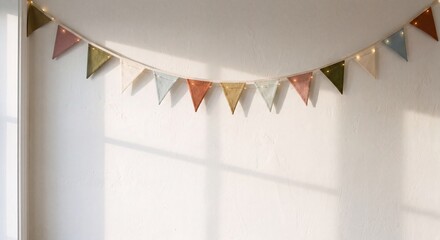 Fabric Bunting Garland with Fairy Lights on White Wall with Sunlight and Shadows