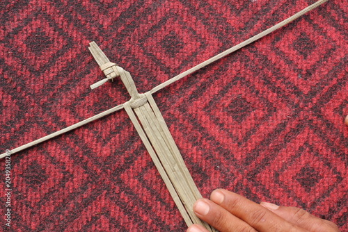 The process of making suket puppets, which are made from a type of grass called mendong
