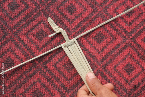 The process of making suket puppets, which are made from a type of grass called mendong