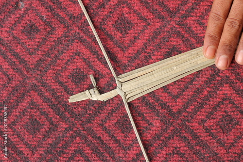The process of making suket puppets, which are made from a type of grass called mendong