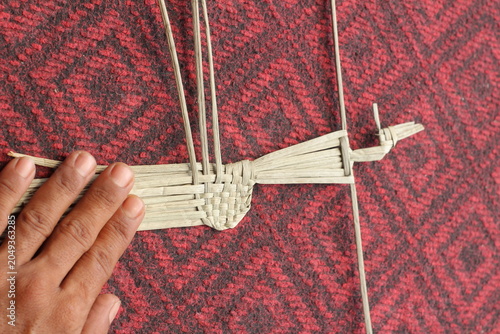 The process of making suket puppets, which are made from a type of grass called mendong