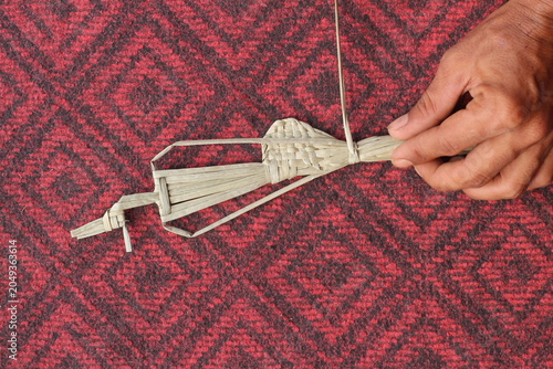 The process of making suket puppets, which are made from a type of grass called mendong