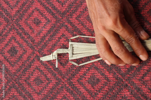 The process of making suket puppets, which are made from a type of grass called mendong