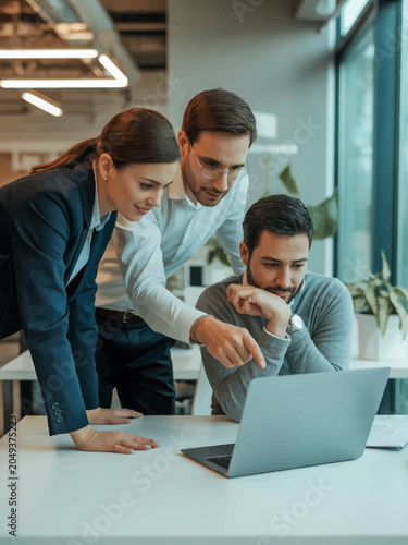 Business People Working on Laptop in Office