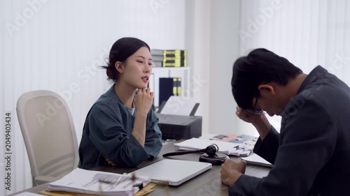 Asian lawyer professional counseling distressed client offering legal advice support during consultation meeting at modern law office explaining contract
