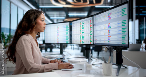 Obraz na płótnie Young Woman Enters Medical Billing Codes On Computer