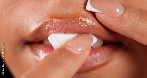 Konstfotografi Young Woman Placing Moist Nicotine Pouch Inside Her Mouth