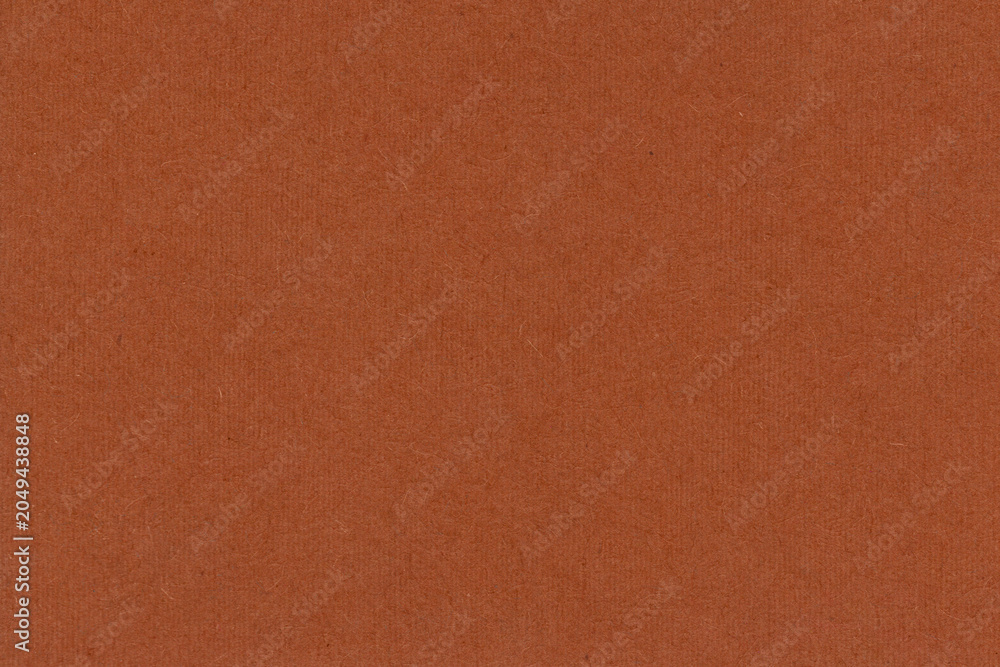 Fototapeta premium Orange brown paper texture with a smooth finish and natural appearance. Versatile background ideal for graphic design, packaging and creative projects.