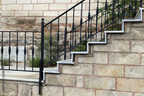 Quadro su tela An outdoor staircase featuring modern white marble steps, situated in front of a