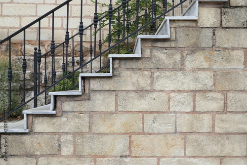 Cuadro en lienzo An outdoor staircase featuring modern white marble steps, situated in front of a