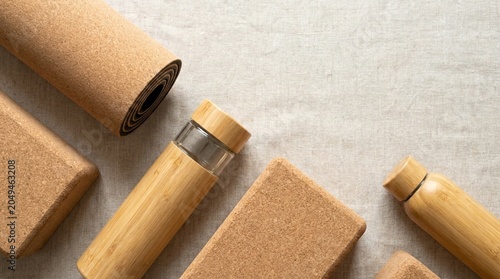 Eco-friendly yoga accessories including cork mat and blocks with reusable bamboo water bottle