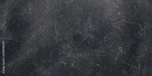 Obraz na płótnie A dark, textured background with numerous scratches and scuffs, suggesting wear and tear