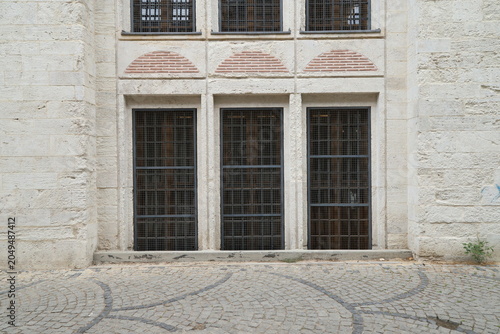 A historic building with large brick-arched windows 