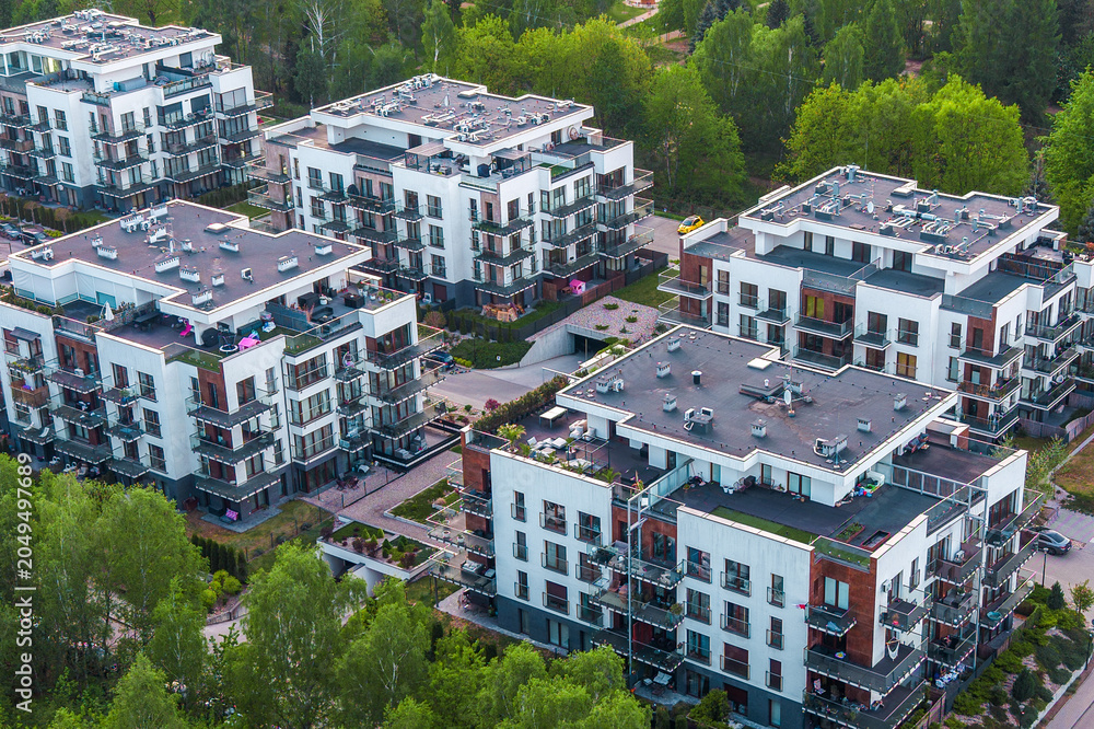Fototapeta premium Apartment complex with balconies patios and garden areas