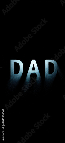 Dad text with dramatic lighting and shadow