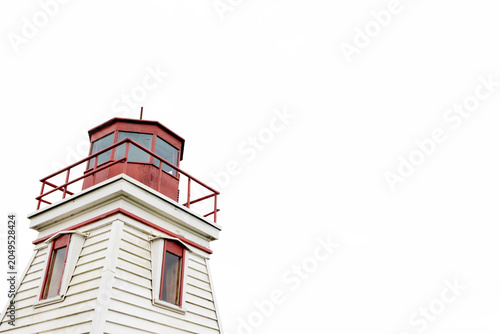 Quadro su tela Historic red and white lighthouse tower photographed from below with ample copy