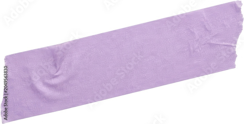 A single piece of torn light purple masking tape lies diagonally across the frame showing texture and folds purple tape adhesive tape roll craft stationery paper sticky repair