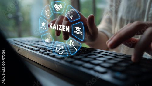 Photos Focused Individual Typing on Keyboard with Kaizen Concept Icons Representing Continuous Improvement and Efficiency in Modern Workplace Environment Quark