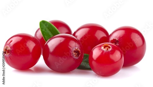 Close-up studio shot of vibrant, ripe berries with glossy skin, clustered together with fresh green leaves. They are isolated against a clean white backdrop