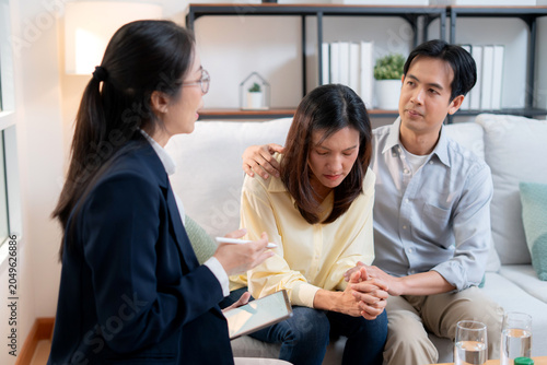 Asian couple therapy counseling and relationship support, mental health, consultation about anxiety, stress and depression, psychologist advising family conflict management, conversation for empathy.