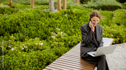 Woman talks on phone while ...