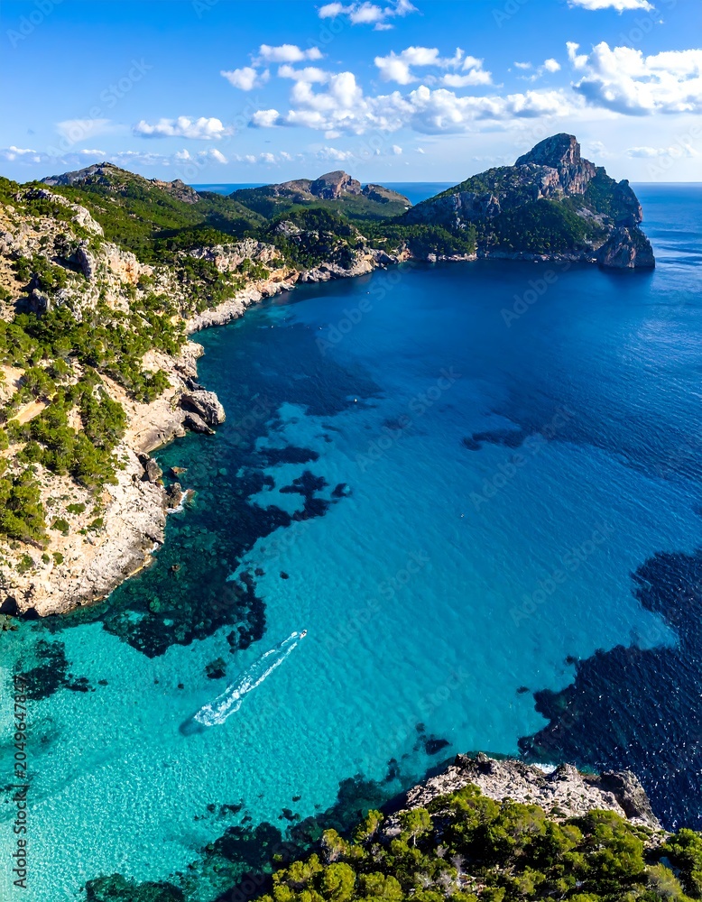 Fototapeta premium Aerial view of a turquoise bay, cliffs, and the sparkling sea