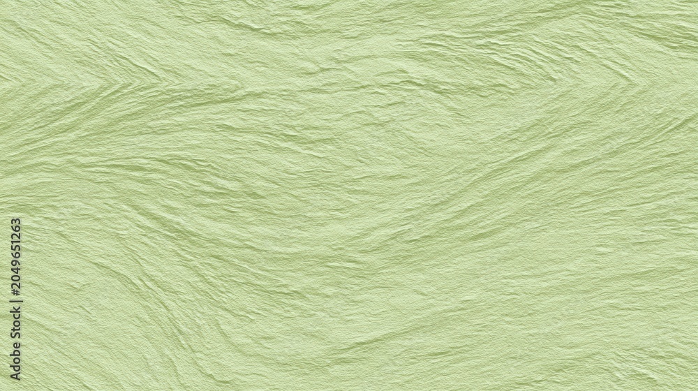 Fototapeta premium Light green textured wall with a subtle, wavy, embossed pattern resembling natural fibers or wood grain, abstract vegetable background for kids